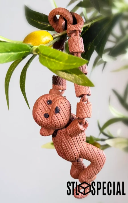 3D printed monkey toy with a hand-knitted look and articulated arms